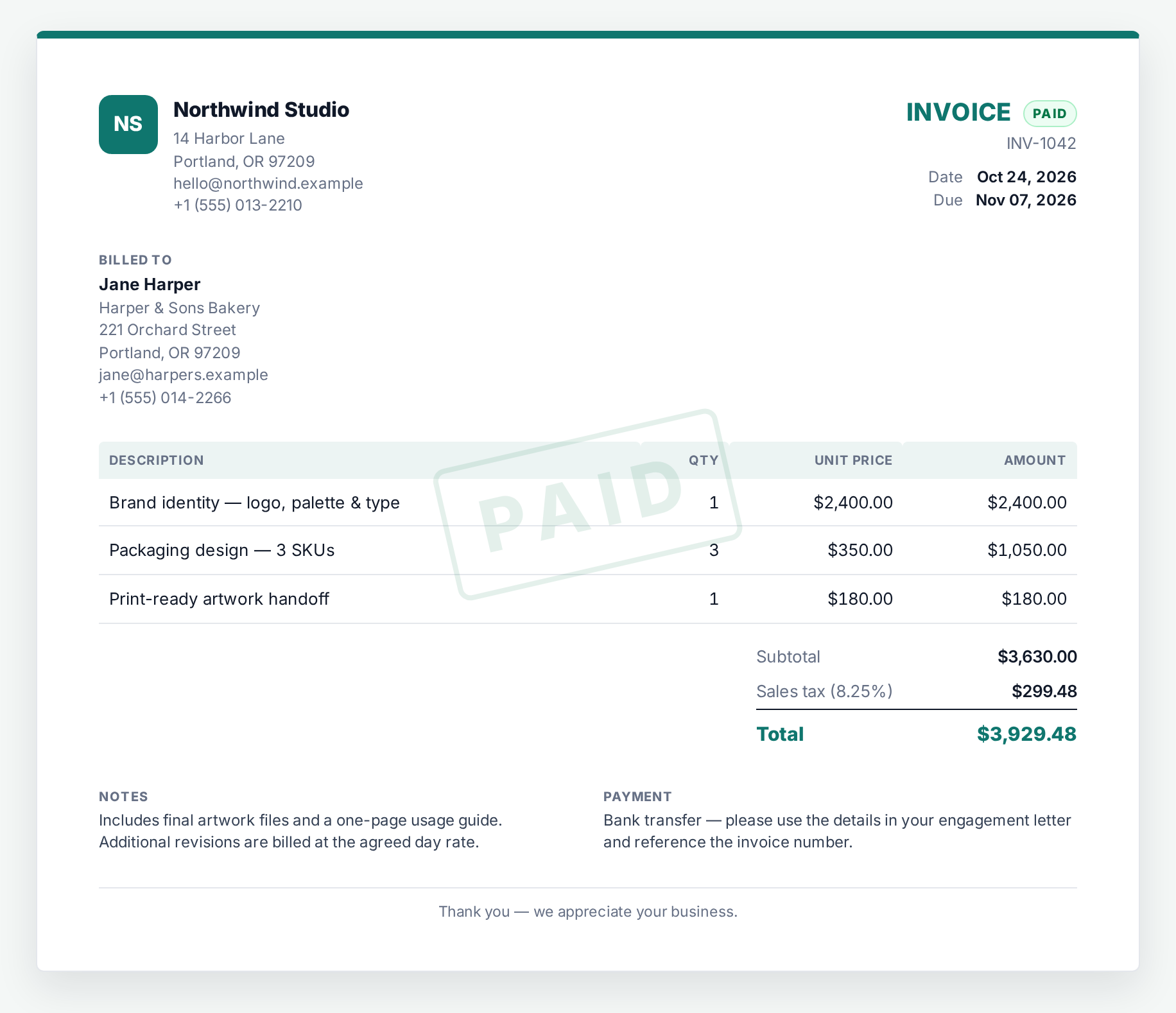A finished InvoiceHarbor invoice with line items, tax, totals and a paid badge